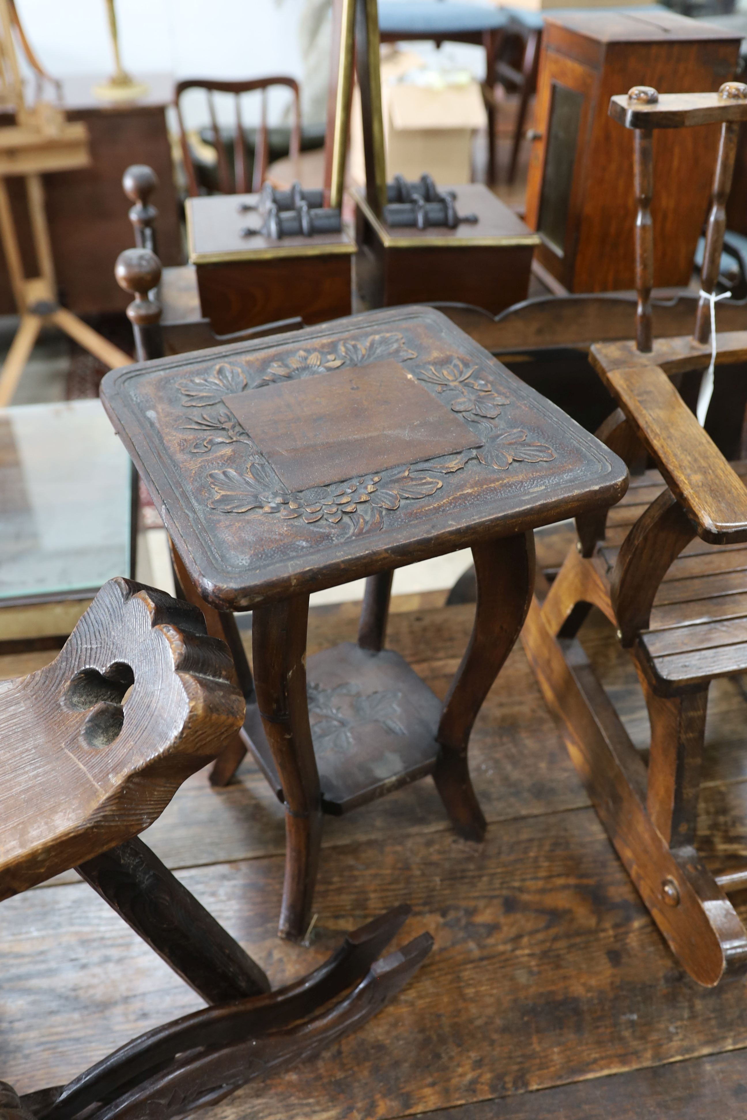 A small child's oak rocking chair, a pair of carved wood bellows and two caned tables